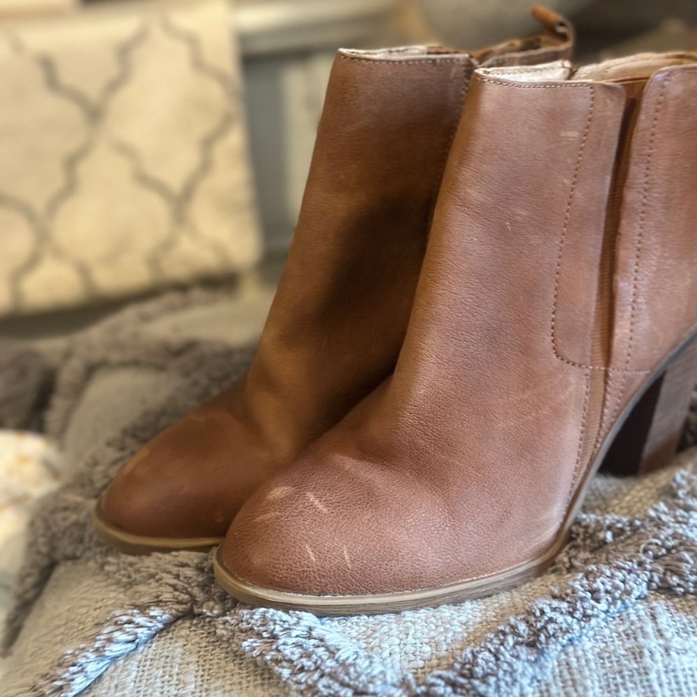 Brown leather Lucky Brand zip up boots with heel. Size 9M. Some scuffs and wear